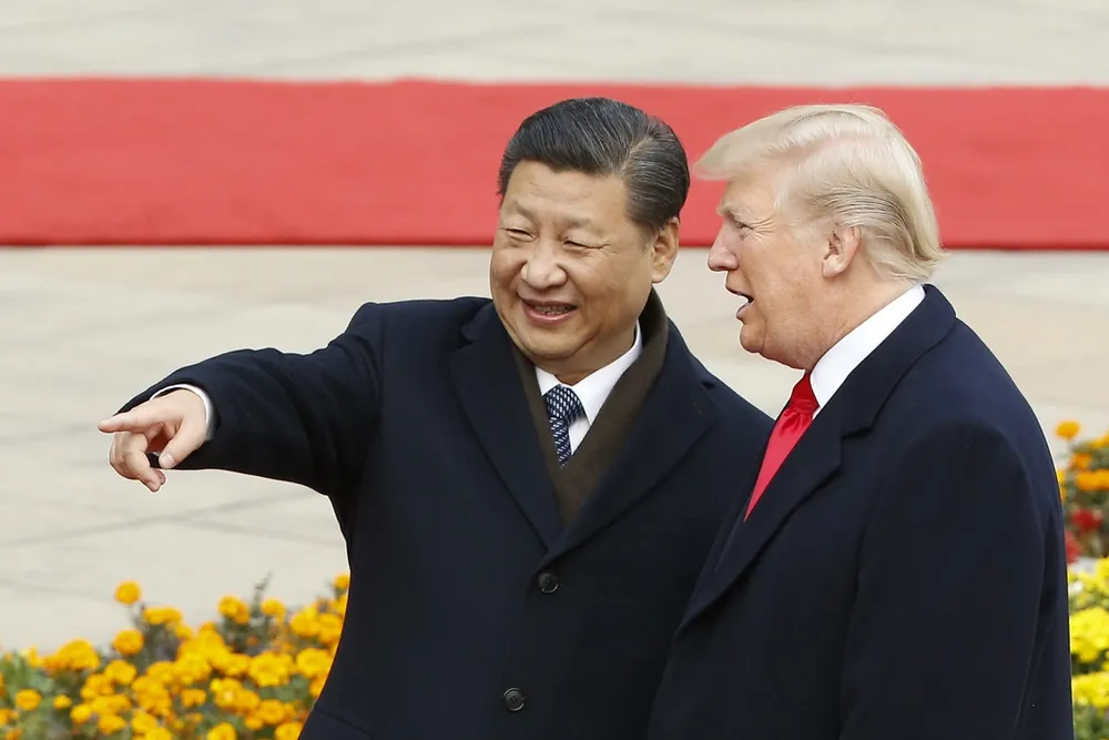 Tổng thống Mỹ Donald Trump (phải) và Chủ tịch Trung Quốc Tập Cận Bình. Ảnh: AFP